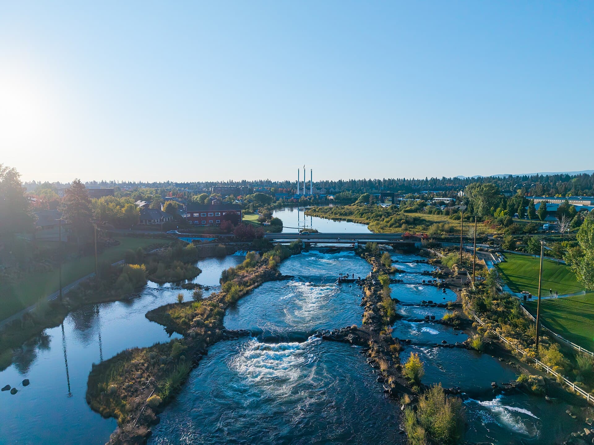 Aerial view of Pacific Northwest river corridor and residential terrain